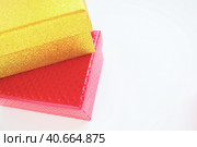 Golden and pink gift boxes on a white background. Decorative holiday box-surprise. Copy space. Стоковое фото, фотограф Юлия Петровская / Фотобанк Лори