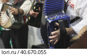 People in folk clothes playing accordion. Стоковое видео, видеограф Константин Шишкин / Фотобанк Лори