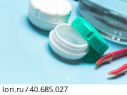 Container for contact lenses, tweezers, glass table. Стоковое фото, фотограф Сергей Толмачёв / Фотобанк Лори