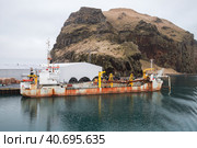 Hopper Dredger vessel is moored in port of Vestmannaeyjar (2017 год). Редакционное фото, фотограф EugeneSergeev / Фотобанк Лори