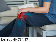 Knee pain, man suffering from osteoarthritis at home. Стоковое фото, фотограф Станислав Тарко / Фотобанк Лори