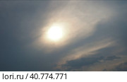 Cirrus clouds cover the disk of the sun with clouds. The disappearance of the sun behind thick dark clouds. Time lapse. Sunbeams in the haze. Sunset for Halloween. Weather forecast. Sky background. Стоковое видео, видеограф Юлия Петровская / Фотобанк Лори