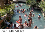 Pammukale, Turkey - July, 19, 2015: People in antique Cleopatra's pool with thermal water in ancient city Hierapolis, near modern Turkey city Denizli. Редакционное фото, фотограф Анна Кривицкая / Фотобанк Лори