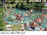 Pammukale, Turkey - July, 19, 2015: People in antique Cleopatra's pool with thermal water in ancient city Hierapolis, near modern Turkey city Denizli. Редакционное фото, фотограф Анна Кривицкая / Фотобанк Лори