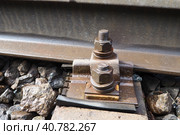 Railways. Metal steel rails and wooden sleepers. Rivets and fasteners on the railroad. Stony backfill of railway tracks. Station Nyrki, Karelia. Стоковое фото, фотограф Юлия Петровская / Фотобанк Лори
