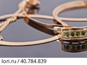 Beautiful and elegant gold earrings with emeralds. Стоковое фото, фотограф Сергей Сергеев / Фотобанк Лори