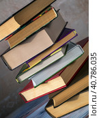 The books are stacked. The stack of books is at an angle to the background. Close-up. The concept of reading, libraries, scientific work, education. Стоковое фото, фотограф Бузмакова Светлана / Фотобанк Лори