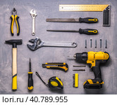 a set of yellow hand tool on a gray background. Стоковое фото, фотограф Енваев Андрей / Фотобанк Лори