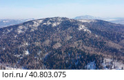 Горный Алтай зимой: хребет Иолго. Вид с воздуха. Altai mountains in winter: Iolgo Ridge. Aerial view. Стоковое видео, видеограф Евгений Романов / Фотобанк Лори