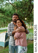 Young married couple feel happy and smile, standing in the forest in the evening. Стоковое фото, фотограф Татьяна Терехина / Фотобанк Лори