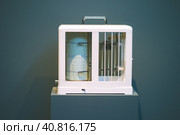 Seismological device for measuring earthquakes. Seismograph records an earthquake on the sheet of measuring paper. Earthquake wave on graph paper. Стоковое фото, фотограф Igor Tichonow / Фотобанк Лори