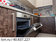Modern kitchen interior in wenge colors with built-in appliances. Стоковое фото, фотограф Сергей Сергеев / Фотобанк Лори
