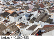 Aerial panoramic view of rooftops of white houses of Olvera town, considered the gate of white towns route in the province of Cadiz, Spain. Стоковое фото, фотограф Matej Kastelic / Фотобанк Лори