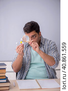 Young male student physicist sitting in the classroom. Стоковое фото, фотограф Elnur / Фотобанк Лори