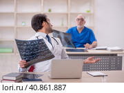 Two male doctors radiologists working in the clinic. Стоковое фото, фотограф Elnur / Фотобанк Лори
