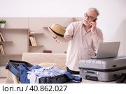 Old man preparing for trip at home. Стоковое фото, фотограф Elnur / Фотобанк Лори