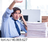Young employee unhappy with excessive work. Стоковое фото, фотограф Elnur / Фотобанк Лори