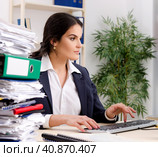 Female employee with too much work in the office. Стоковое фото, фотограф Elnur / Фотобанк Лори
