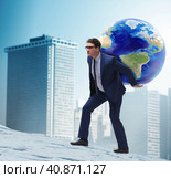 Businessman carrying Earth on his shoulders. Стоковое фото, фотограф Elnur / Фотобанк Лори
