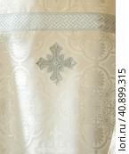 Cloth of a cassock close up. Liturgical clothes, liturgical vestments, robes. Embroidery symbol on the priest's cassock religion clothing orthodox. Стоковое фото, фотограф Саблин Станислав / Фотобанк Лори