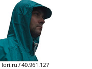 Depressive concept with lonely man in raincoat standing on wet road under rain close up isolated. Стоковое фото, фотограф Татьяна Терехина / Фотобанк Лори