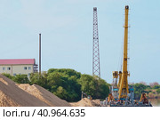 Big pile of sand. Building with a chimney in the background. Summer morning. Deepening the bottom of the river. Стоковое фото, фотограф Алексей Игнатов / Фотобанк Лори