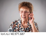 Seniors talking mobile phone. Стоковое фото, фотограф Гладских Татьяна / Фотобанк Лори