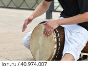 A man plays the djembe drum on a street in Moscow, Russia. Стоковое фото, фотограф Володина Ольга / Фотобанк Лори