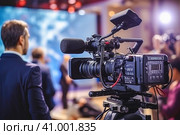 The cameraman is filming an entertainment show on the set. Стоковое AI-изображение, AI-художник Юрий Поздников / Фотобанк Лори