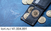 Crypto-currency: Leather wallet with metal bitcoin coins. Стоковое фото, фотограф Енваев Андрей / Фотобанк Лори