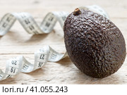 Fresh organic avocado Haas and measuring tape. Стоковое фото, фотограф Виктория Панченко / Фотобанк Лори