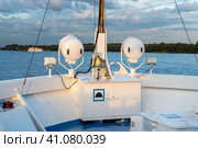a ship's bell on the bow of a ship going down the river. ship 's rynda. Стоковое фото, фотограф Андрей Знаменский / Фотобанк Лори