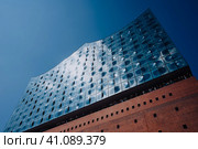 Hamburg, Germany - May 11, 2018: Elbphilharmonie building in HamburgCity with tourist people, Hamburg, Germany. Редакционное фото, фотограф Igor Tichonow / Фотобанк Лори