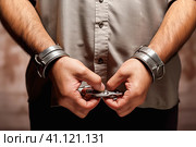 Handcuffed hands close-up. Стоковое AI-изображение, AI-художник Юрий Поздников / Фотобанк Лори