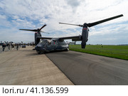 BERLIN, GERMANY - APRIL 25, 2018: V/STOL military transport aircraft Bell Boeing V-22 Osprey. US Air Force. Exhibition ILA Berlin Air Show 2018. Редакционное фото, фотограф Sergey Kohl / Фотобанк Лори