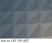 Geometric abstract background from triangles, squares and lines. Three-dimensional bulge. The volume and flex of the diagonally positioned foam material. Blue, gray and pink shades. Стоковое фото, фотограф Юлия Петровская / Фотобанк Лори