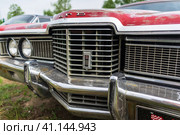 BERLIN - APRIL 27, 2019: Fragment of the full-size station wagon Ford LTD Country Squire, 1972. Редакционное фото, фотограф Sergey Kohl / Фотобанк Лори