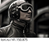 Biker in a modern helmet. Стоковое AI-изображение, AI-художник Кирилл Черезов / Фотобанк Лори