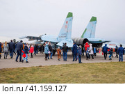 Military aircraft fighters and other aircraft at the Krasnodar airfield. Exhibition of military equipment in honor of the defender of the fatherland. Festive event. People inspect military equipment. (2017 год). Редакционное фото, фотограф Леонид Еремейчук / Фотобанк Лори