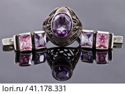 Carved silver ring with earrings with purple gemstones. Стоковое фото, фотограф Сергей Сергеев / Фотобанк Лори