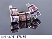Carved silver ring with earrings with purple gemstones. Стоковое фото, фотограф Сергей Сергеев / Фотобанк Лори