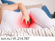 Stomach ache, woman with abdominal pain suffering at home. Стоковое фото, фотограф Станислав Тарко / Фотобанк Лори