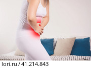 Stomach ache, woman with abdominal pain suffering at home. Стоковое фото, фотограф Станислав Тарко / Фотобанк Лори