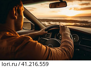 Man Driving Car on Beach at Sunset. Стоковое AI-изображение, AI-художник Поликарпов Владимир Владимирович / Фотобанк Лори