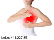 Breast test, woman examining her breasts for cancer, heart attack, pain in human body isolated on white. Стоковое фото, фотограф Станислав Тарко / Фотобанк Лори