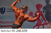 Russia, Nizhny Novgorod, Volzhskaya embankment 21, 05.06.2021. Athletes, men in swimming trunks on stage, bodybuilding performance. Россия, Нижний Новгород, Волжская набережная, 21, 05.06.2021. Спортсмены, мужчины в плавках на сцене, выступление по бодибилдингу. Редакционное видео, видеограф Egor Sarantstv / Фотобанк Лори
