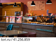 The interior of a stylish, modern cafe, bakery Croissant Dore in Nizhny Novgorod. Russia, Nizhny Novgorod, August 2023. Редакционное фото, фотограф Photojuli / Фотобанк Лори