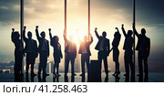 The business team rejoices at the event together in the office against the background of the rising sun. Generated by AI . Стоковое AI-изображение, AI-художник Ярославский Максим / Фотобанк Лори