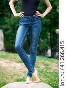 Front view of a long women legs posing with jeans. Стоковое фото, фотограф Андрей Аркуша / Фотобанк Лори