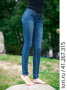 Front view of a long women legs posing with jeans. Стоковое фото, фотограф Андрей Аркуша / Фотобанк Лори